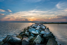 Sunset Over A Rock Jetty On The Chesapeake Bay