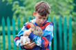 © rimmdream - Portrait of boy, he is holding rabbit