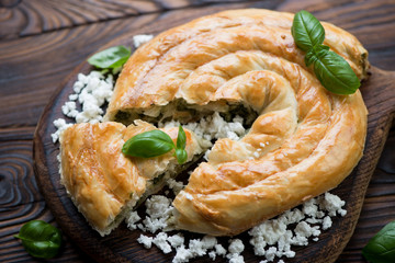 Wall Mural - Close-up of sliced burekas pie with cheese and spinach