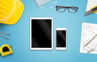 Leinwandbilder - Tablet and smart phone mockup. Work desk with glasses, paper, pencil, construction tools.