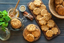 Peanut Butter And Honey Cookies On A Dark Wood Background. Selective Focus