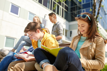 Wall Mural - group of students with notebooks at school yard