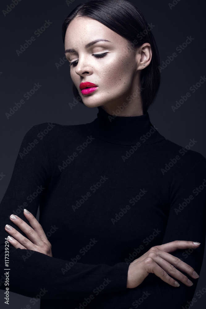 Stock-Foto „Beautiful brunette girl in a black dress, straight hair and ...
