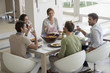 © onoky - Group of happy friends having lunch at dining table