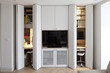 © Arcaid Images - Renovated House in Tooting, London. Part of the Totterdown Estate constructed between 1903-1911. Built in cupboards and TV showing hidden work desks.