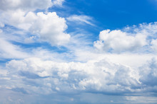 Dense White Clouds In Blue Sky In Summer Day