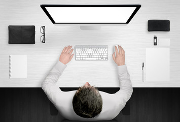 Wall Mural - business man work hard on the computer. top view of office desk with equipment.