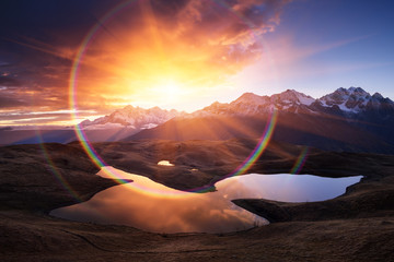 Wall Mural - Mountain landscape with lake and beautiful sunrise