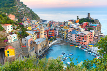 Wall Mural - Aerial view of Vernazza fishing village at sunset, seascape in Five lands, Cinque Terre National Park, Liguria, Italy.