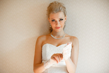 Charming glance of the blonde bride before the wedding