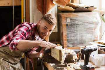 Wall Mural - carpenter working with wood plank at workshop