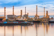 © Pawinee - Oil refinery plant at twilight.