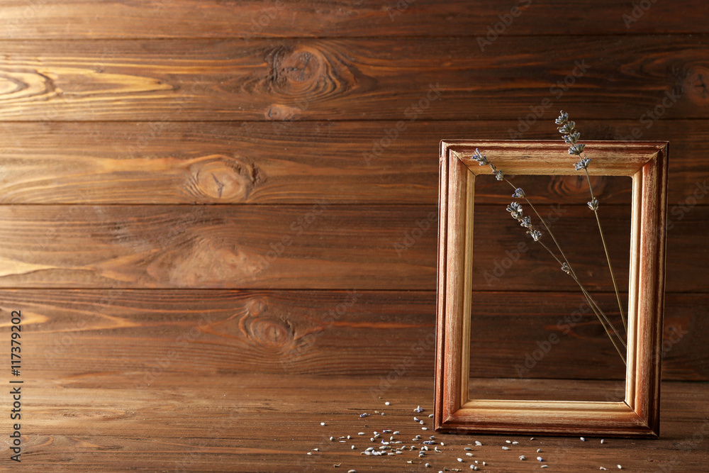 Lavender with frame on wooden background