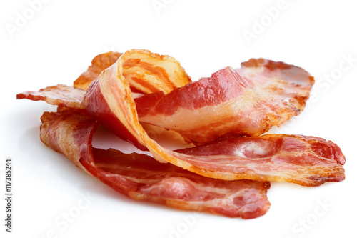 Fotomural Three strips of fried crispy bacon isolated on white.
