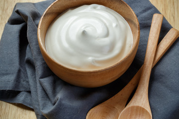 Wall Mural - Greek yogurt on wooden background