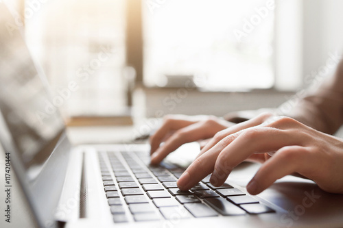 Fotografía Typing on laptop closeup, chatting in Facebook, meeting website