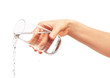 © IntelWond - Water pouring from full drinking glass in woman's hand