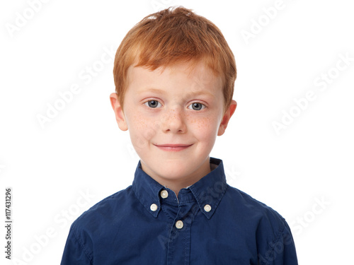 Fotografía Close up face of a smiling ginger boy isolated on white background