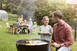 © Westend61 - Smiling father and daughter on a family barbecue