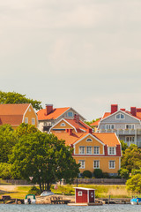 Wall Mural - Ancient swedish houses in the seaside bay of Karlskrona