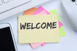 © Markus Mainka - Welcome new employee colleague refugees refugee immigrants desk