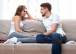 © perfectlab - Man and  young woman sitting on a couch and talk.