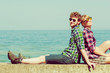 © anetlanda - hiking couple relaxing on sea coast