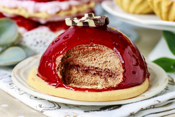 Sticker - Chocolate cake with red fruit icing. Party table, various cakes