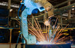 Auto robot welding auto part in factory