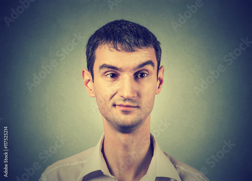 Fotografia, Obraz Skeptic man with an expression of discontent on his face