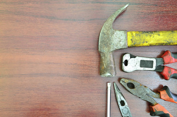 Rusty mechanic tool on wooden background