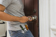 locksmith try to open the door with key maker tool - can use to display or montage on products