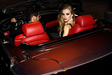 Wall Mural - Meeting stars on the red carpet. Couple in luxury car.