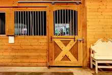 Stable Barn With Beam Ceiling And Door To A Clean Stall.