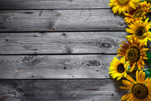 Old Wooden Background With Sunflowers.