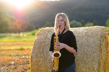 Female musician playing a tenor saxophone