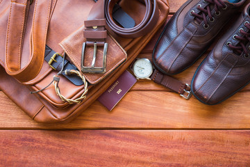 Sticker - Men's casual outfits with leather accessories on wooden background