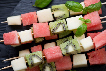 Poster - Close-up of juicy fruit kebabs, selective focus, high angle view