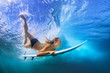 © Tropical studio - Young active girl in bikini in action - surfer with surf board dive underwater under breaking big ocean wave. Family lifestyle, people water sport adventure camp, beach extreme swim on summer vacation