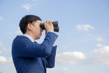 Asian businessman searching and looking for future opportunities