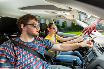 Wall Mural - Couple driving the car