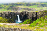 Fototapeta Tęcza - View of high waterfall in north Iceland