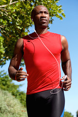 Fit young man running outside