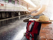 Asian traveler man with belongings waiting for travel by train at Chiang Mai train station, Thailand. Vintage effect