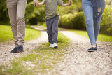 Fototapeta  - Close Up Of Family Going For Walk In Summer Countryside