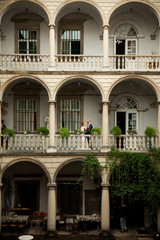 Wall Mural - A look from a far on the wedding couple posing on the Italian ba