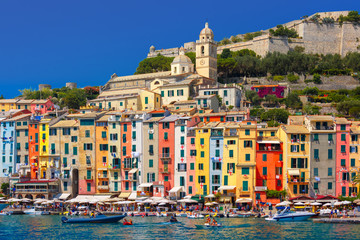 Canvas Print - Panoramic view of colorful picturesque harbour of Porto Venere, San Lorenzo church and Doria Castle on the background, La Spezia, Liguria, Italy.