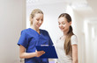 © Syda Productions - doctor or nurse with clipboard and girl patient