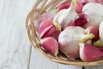 fresh garlic on wooden surface