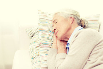 Poster - happy senior woman sleeping on pillow at home